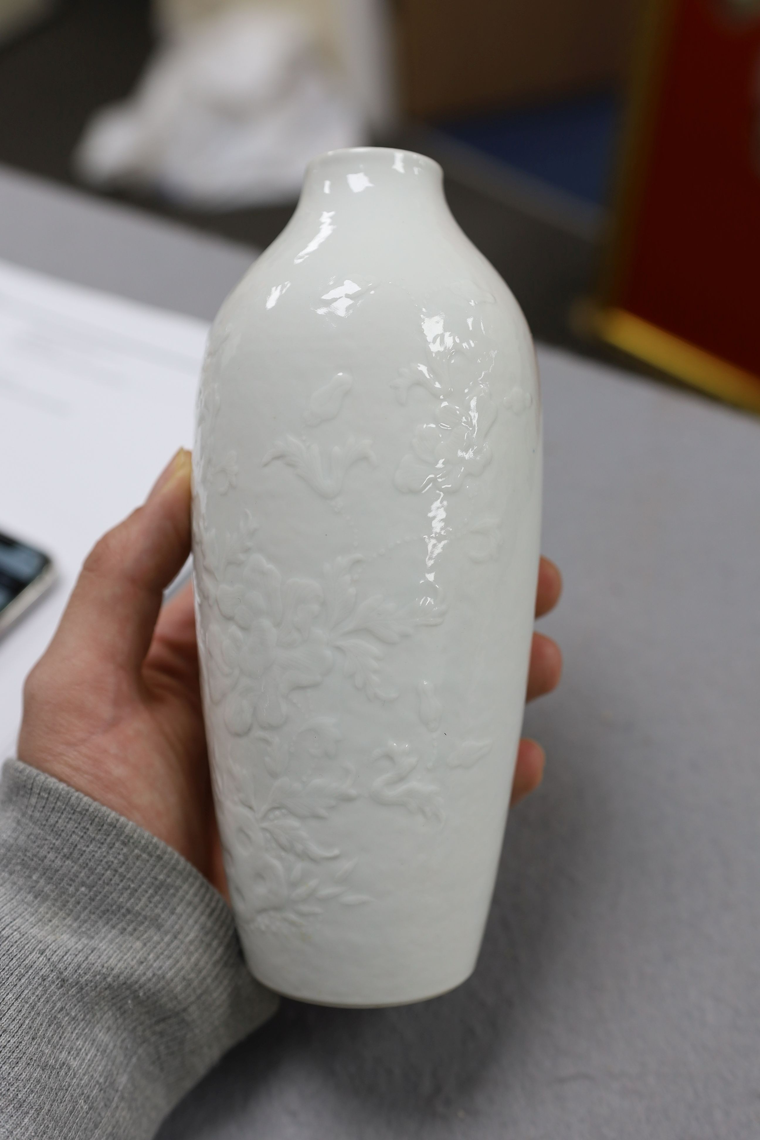 A Chinese moulded white glazed vase, Qianlong period, 18.3cm high, glaze blemish
